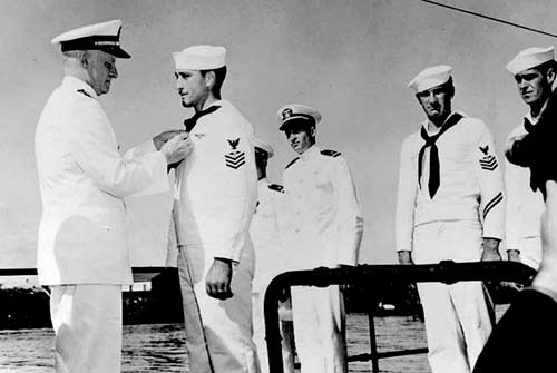 Admiral Nimitz pins Pilot First Class Leonard H. "Snuffy" Wagoner